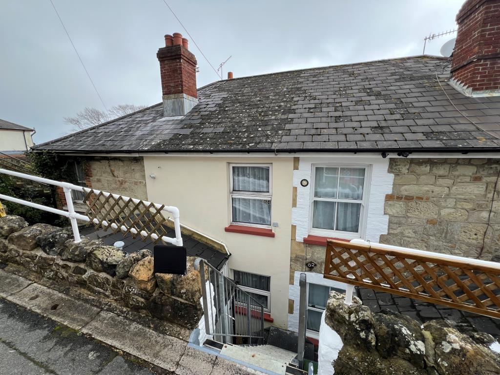 Lot: 148 - TWO-BEDROOM HOUSE FOR INVESTMENT OR OCCUPATION - Front of property from elevated road